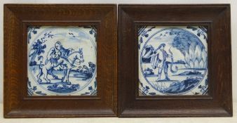 Pair 17th/ 18th century Delft blue tiles painted with Biblical scenes, within oak frames,