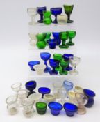 Collection of various glass and ceramic eye baths including some glass marked Optrex Safeguards