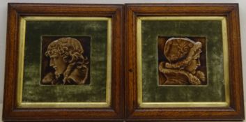 Pair late 19th century relief moulded portrait tiles,