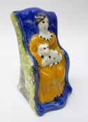 18th/ 19th century Prattware type model of woman with cat in rocking chair with spongeware