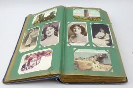 Postcard album containing approximately 450 Edwardian and later postcards,