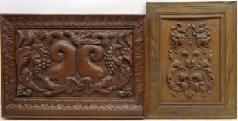 Early 20th century carved oak panel depicting dolphins and fruiting vines,
