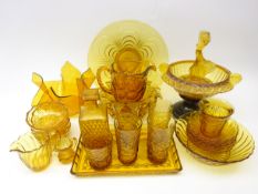 Collection of vintage amber glass including posy bowl with matched figural frog on black stand,