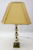 Bronzed table lamp, graduated globular glass column on stepped base with shade,