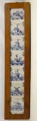 Set of seven 18th century blue Delft tiles painted with landscapes and seascapes incorporating