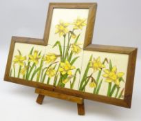 Set of four 19th/ early 20th century tiles painted with Daffodils signed DM,