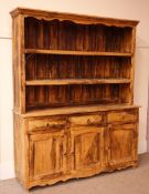 Large hardwood dresser with raised two tier rack, projecting cornice,