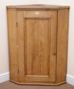 19th century pitch pine wall hanging corner cabinet, single panelled door enclosing two shelves,