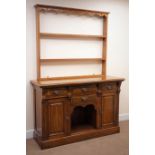 Early 20th century oak dresser, three tier plate rack, four drawers, two cupboard doors,