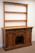 Early 20th century oak dresser, three tier plate rack, four drawers, two cupboard doors,