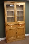 Traditional solid pine display bookcase on cupboard,