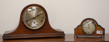 20th century arched oak cased mantle clock with silvered Arabic dial,