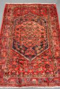 Hamadan red ground rug, hand knotted, repeating border,