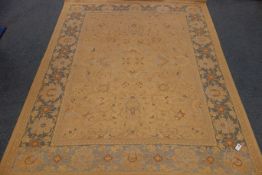 Persian style gold ground rug, floral field, repeating border,