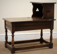 Early 20th century oak telephone table, hinged seat, turned supports joined by stretchers, W66cm,