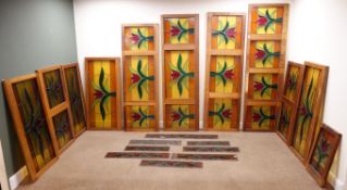 Eleven pieces of mahogany cased lead framed stained glass (W209cm, H62cm,