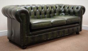 Three seat Chesterfield sofa, upholstered in deep buttoned green leather,