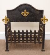 Cast iron fire dog grate, raised shaped back panel, Fleur-de-lys finials, W57cm, H61cm,