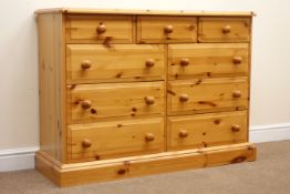 Solid pine chest, moulded top, three short and six long drawers, plinth base, W126cm, H92cm,