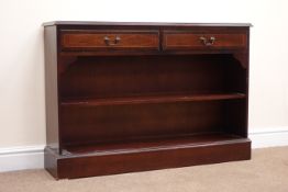 Regency style cross banded and inlaid mahogany bookcase, two drawers, single shelf, plinth base,