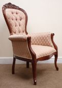 Victorian style mahogany framed armchair, upholstered in deep buttoned salmon coloured fabric,