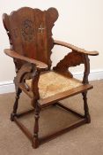 Early 20th century oak chair, carved crests on the splat, drop in rush seat,