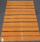 Kilim yellow ground rug with striped field,