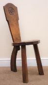 Gnomeman oak milking stool by Thomas Whittaker of Littlebeck, solid shaped back with carved rose,