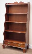 Reproduction mahogany waterfall bookcase, four shelves, two drawers, shaped bracket supports, W81cm,