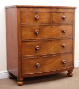 Victorian mahogany chest, two short and three long cockbeaded graduating drawers, turned supports,