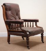 Late Victorian oak framed gentleman's armchair, upholstered in a maroon leather,