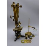 Late 19th century brass binocular microscope, with rack and pinion coarse and fine adjust E.