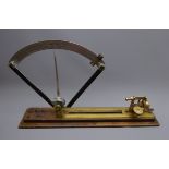 Brass cotton mill yarn tester, adjustable bed with alloy scale on mahogany base, L68cm,