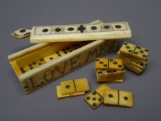 Small rectangular Scrimshaw box containing twenty three miniature Whale Bone dominoes,