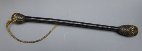 19th century baleen woven bosun's cosh, the twisted shaft connecting two weighted bulbous ends,