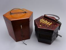 Victorian rosewood hexagonal concertina with fretworked ends and total of thirty-nine bone buttons,