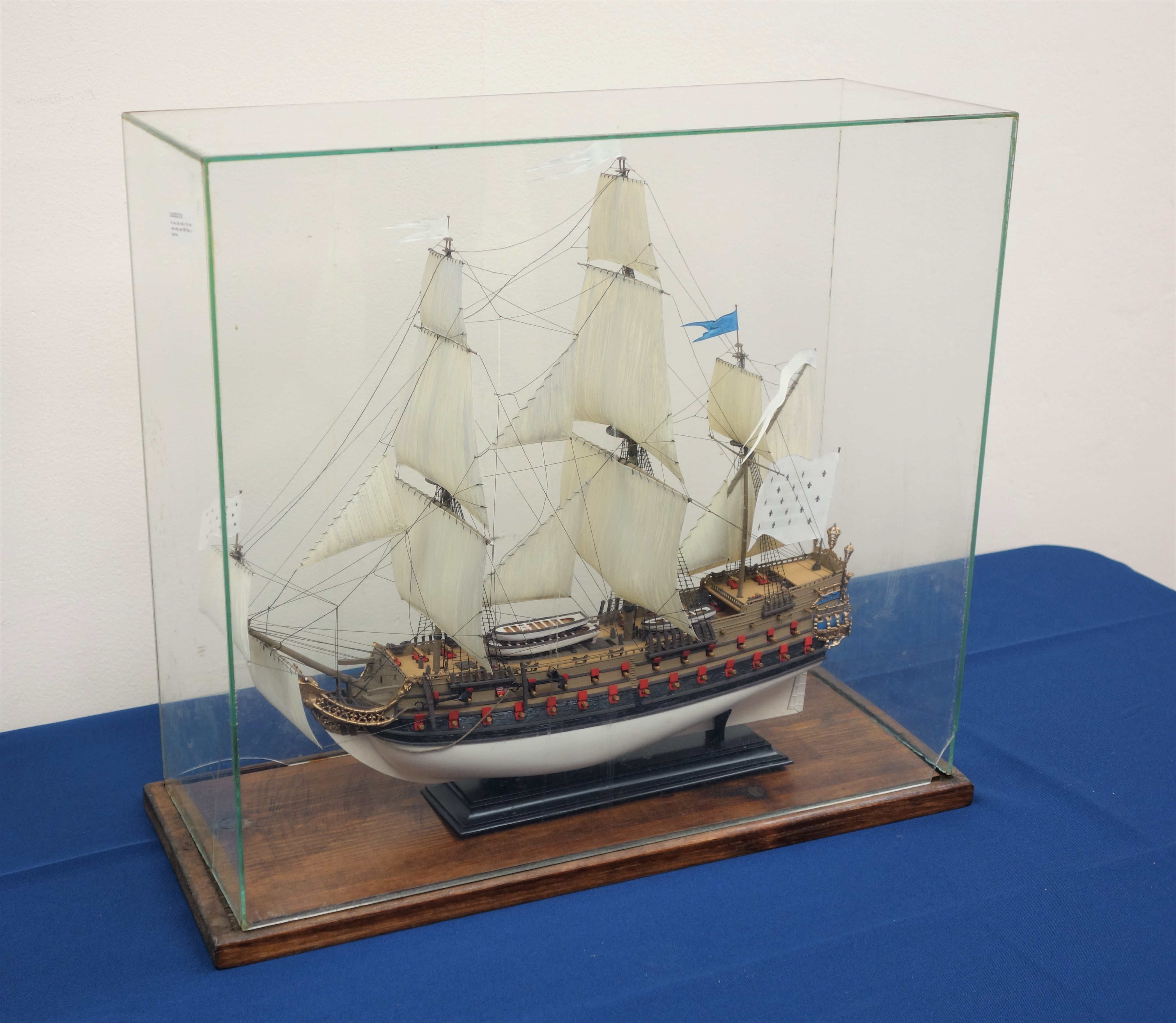 Kit made scale model of the twin masted sailing vessel HMS Phenix, in glazed case, W51cm, 45cm,