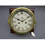 Brass bulkhead clock, painted Roman dial with subsidiary seconds and twin train movement,