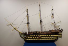 Large scale model of Nelson's Flagship HMS Victory, three masted, with sails up, painted decoration,