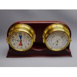 Sewills Precision Aneroid barometer and a similar Tide Clock, both in bulkhead type cases,