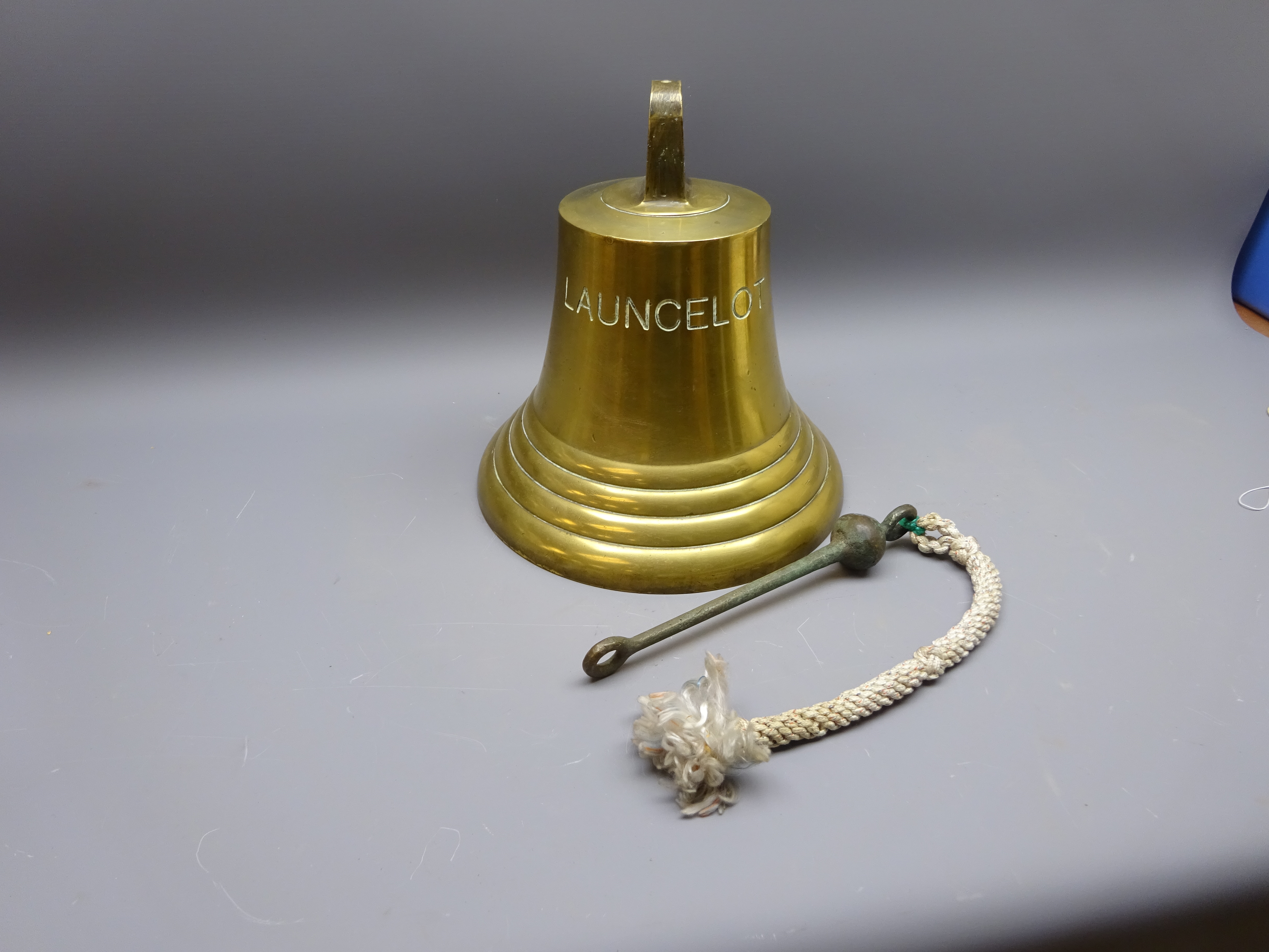 Large metal ships bell, of typical shape with stepped rim, stamped 'Launcelot',