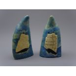 Pair of Sperm whale teeth, relief decorated and painted with twin masted whaling ships, H14.