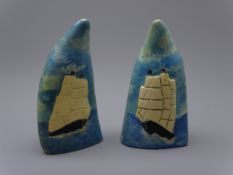 Pair of Sperm whale teeth, relief decorated and painted with twin masted whaling ships, H14.