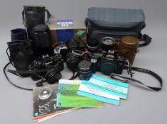 Canon camera bodies A-1, EOS 10 with box & EOS 1000, six lenses - FD 50mm 1:1.8, FD 28mm 1:2.