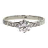 18ct white gold single stone diamond ring, with diamond set shoulders, stamped 18,