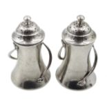 Pair of Art Nouveau silver pepperettes,