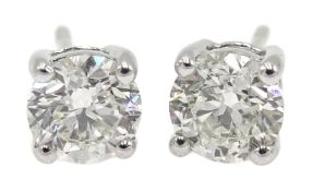 Pair of 18ct white gold diamond stud earrings, total diamond weight 1.