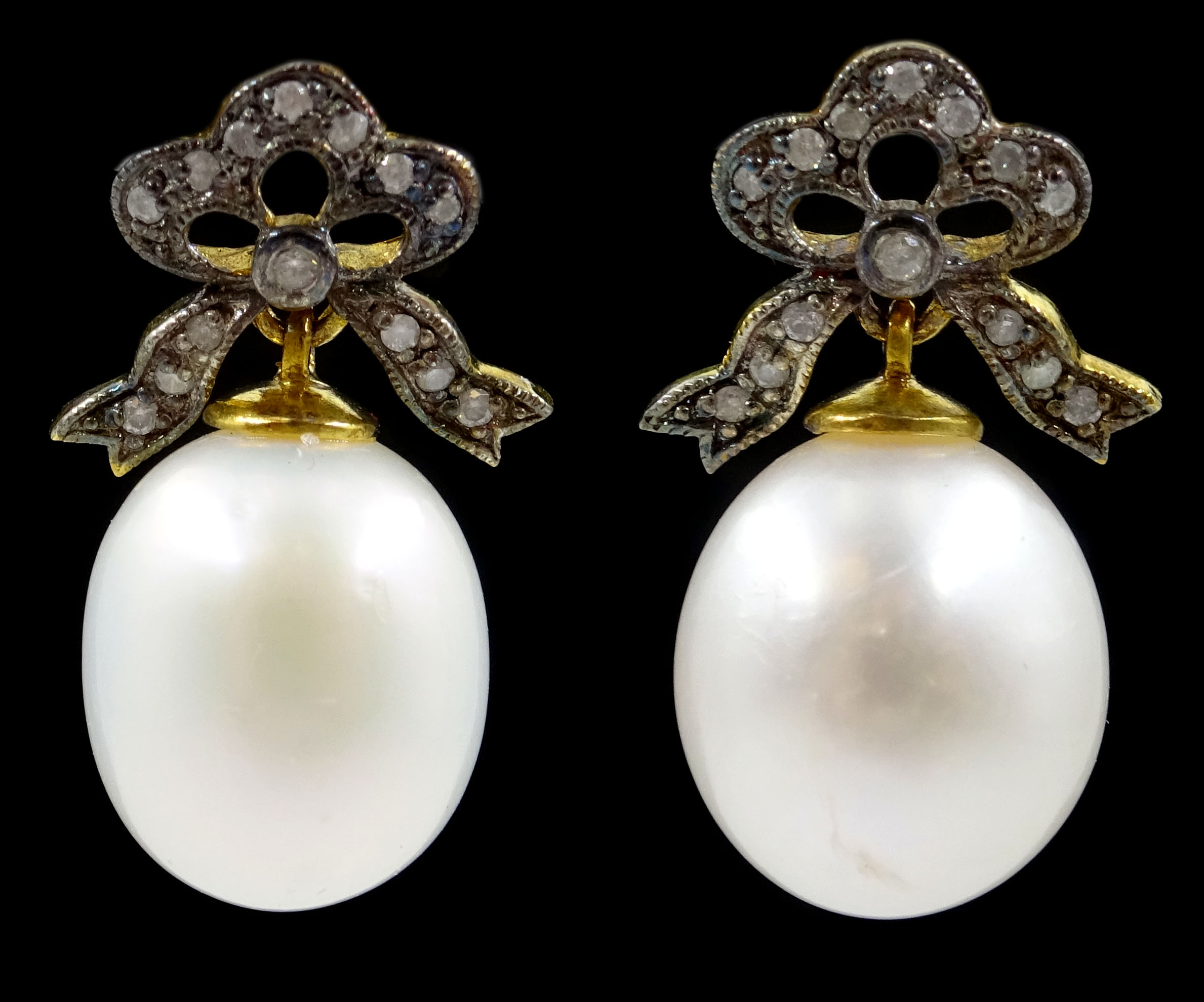 Pair of pearl drop earrings with diamond bow tops