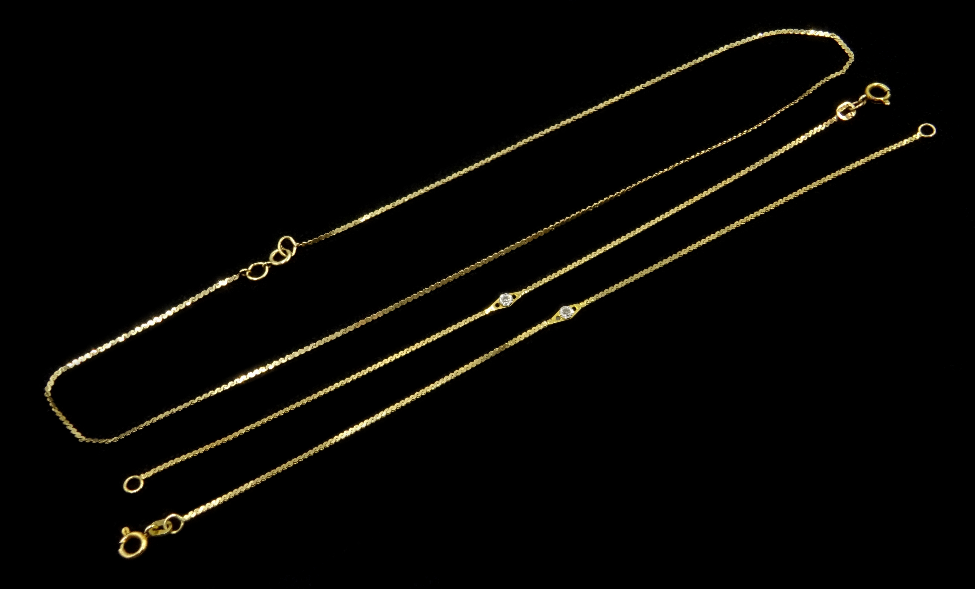 Two 9ct gold chain bracelets each set with a single diamond and a 9ct gold chain necklace 4gm