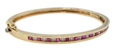 9ct gold channel set ruby and diamond hinged bangle,